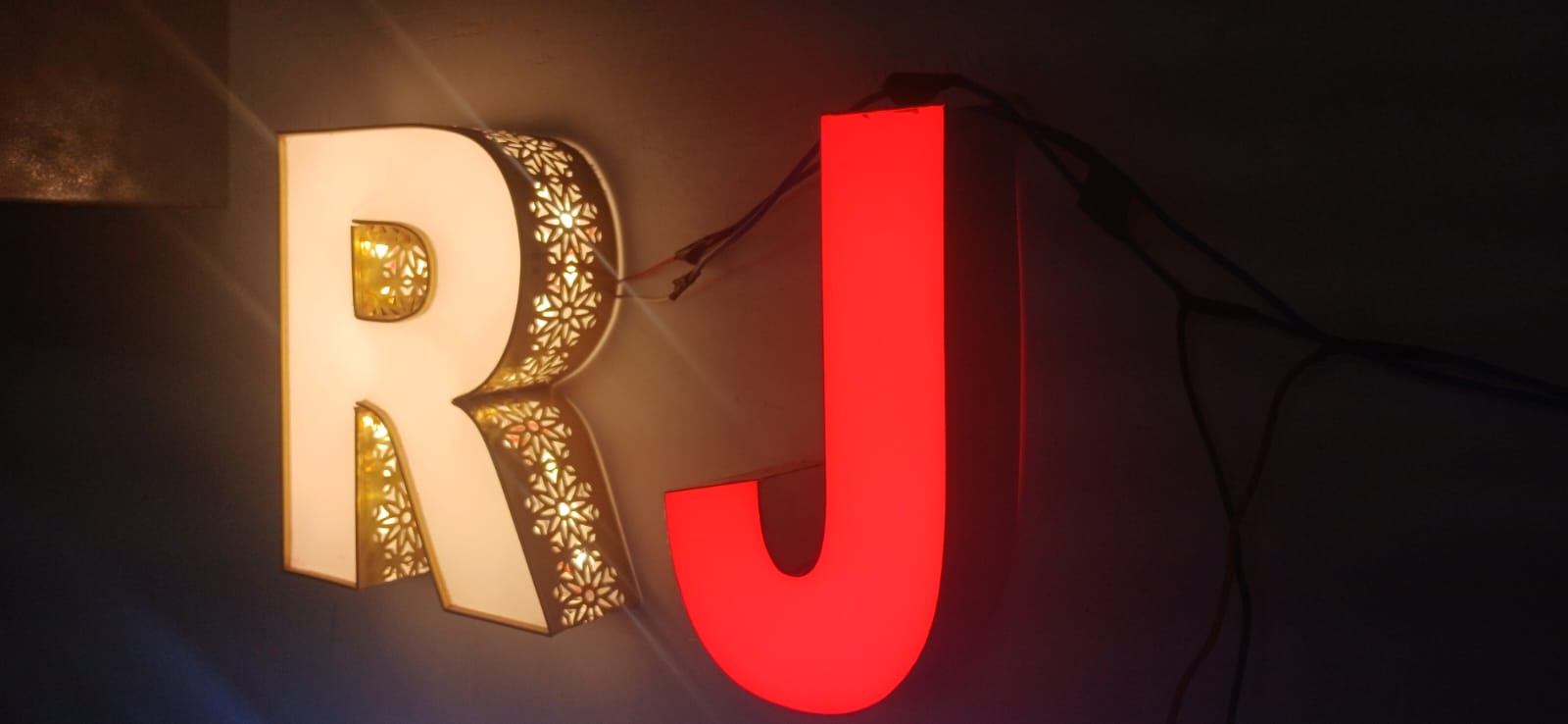 Halo-lit filigree and face-lit acrylic channel letters, fabricated in-house